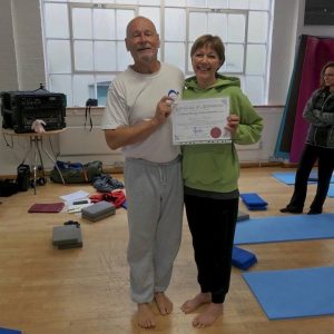 Kate Davies receiving her Stretch Therapy certificate from Kit Laughlin